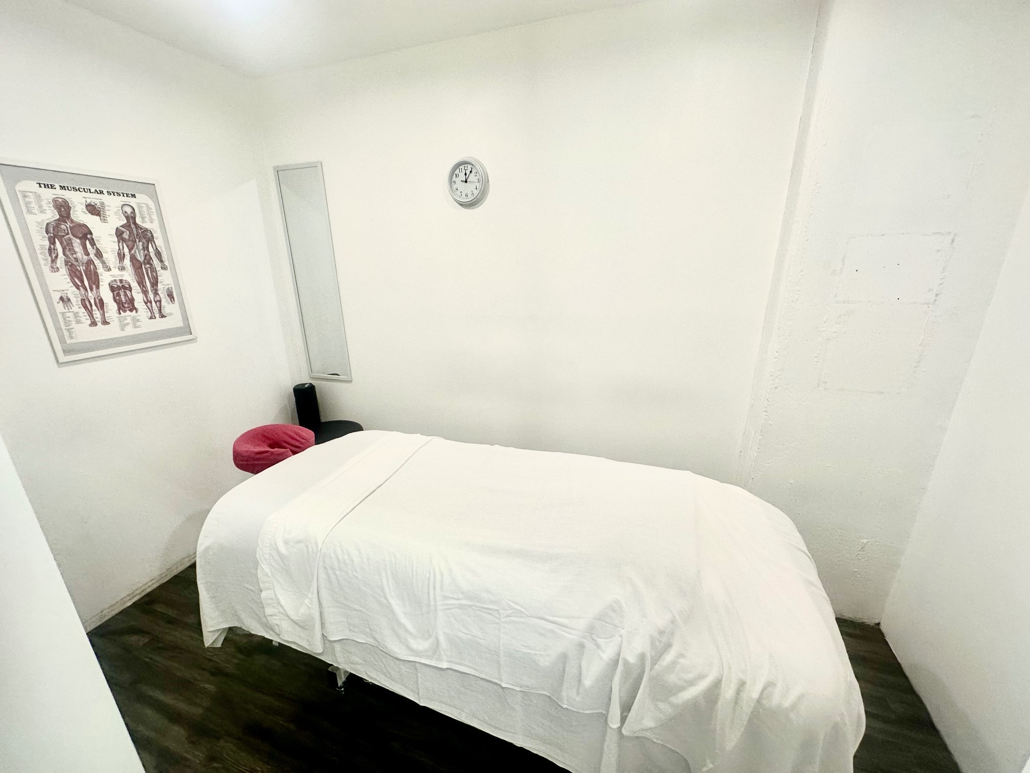 Locus Health Centre private treatment room with massage table