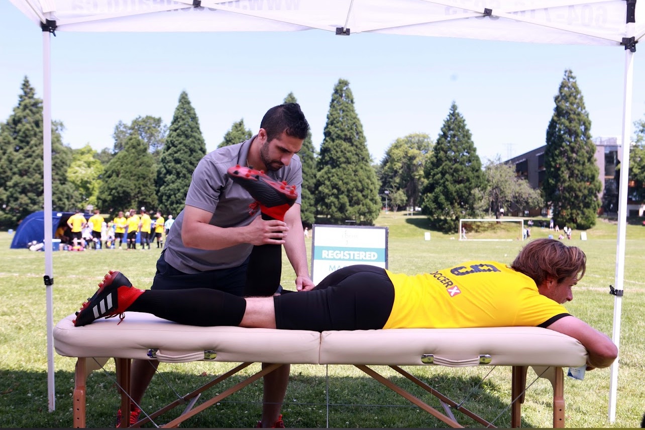Locus Health RMT treating soccer player at SoccerX tournament