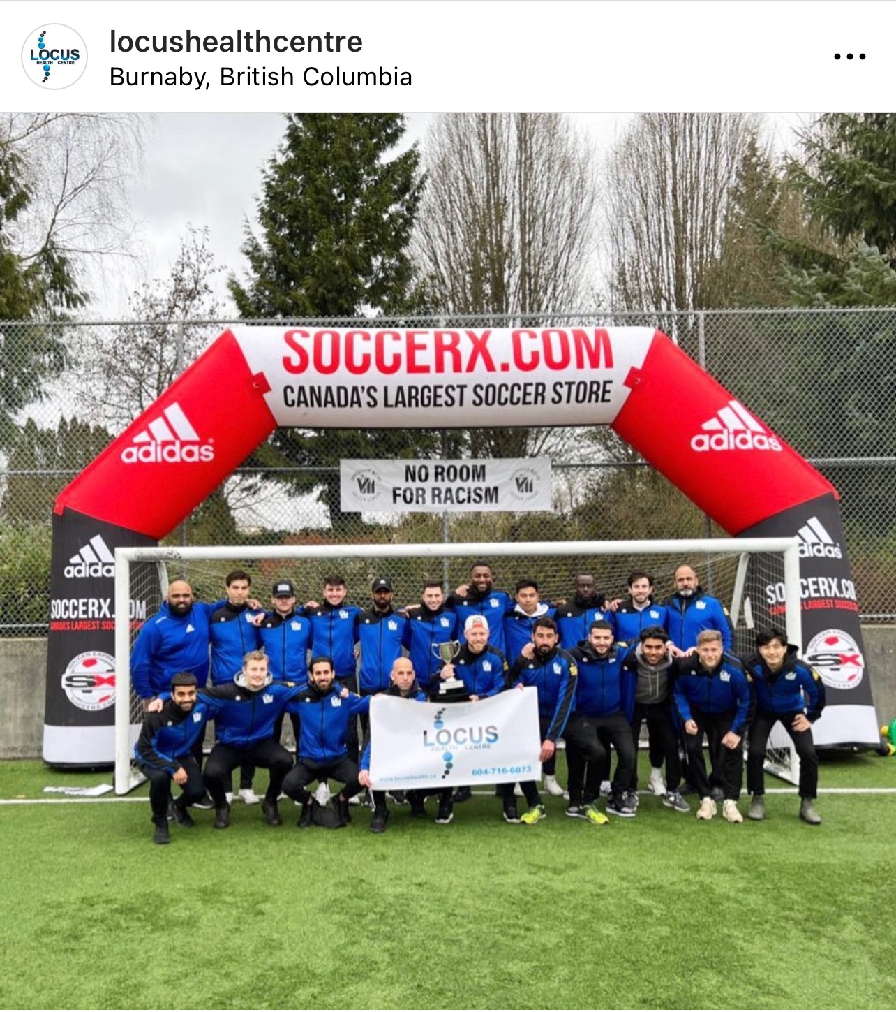 Locus Health team photo with banner at Burnaby soccer tournament