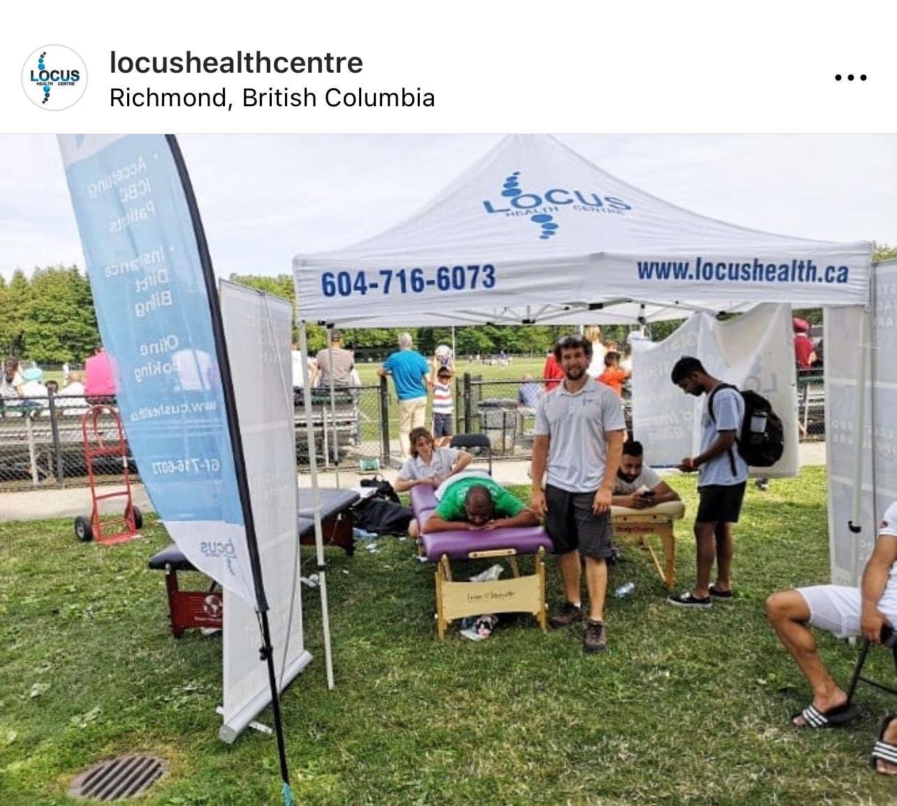 Locus Health tent providing massage therapy at Richmond community event